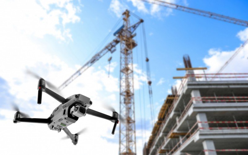 Modern drone flying at building site. Aerial survey