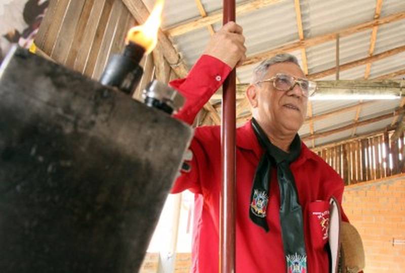 Dalmiro Rodrigues, 66, guards the Creole flame at the ATGF camp. 