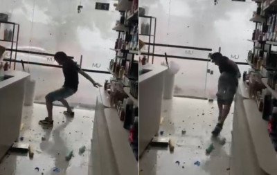 VÍDEO: Cabeleireiro é empurrado pela força do vento durante temporal na região